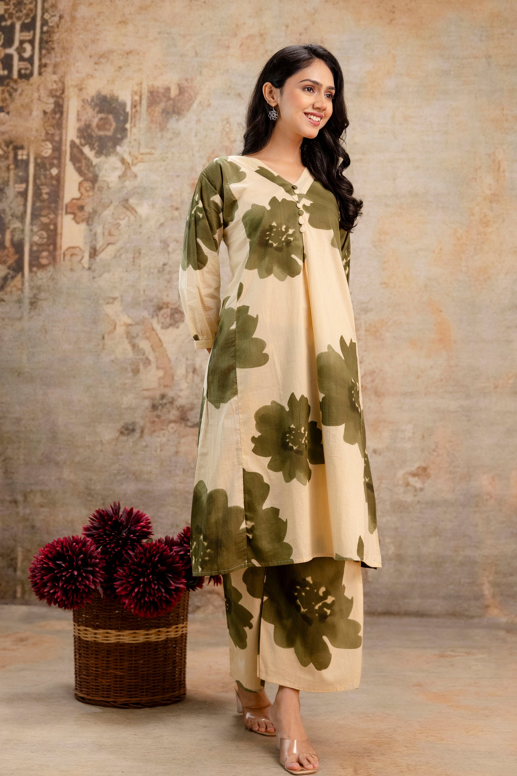 Elegant beige kurti with bold green floral print

V-neck design with center pleats for added style

Crafted in soft, breathable cotton fabric

Full-length straight cut ideal for everyday wear

Styled with matching floral print pants