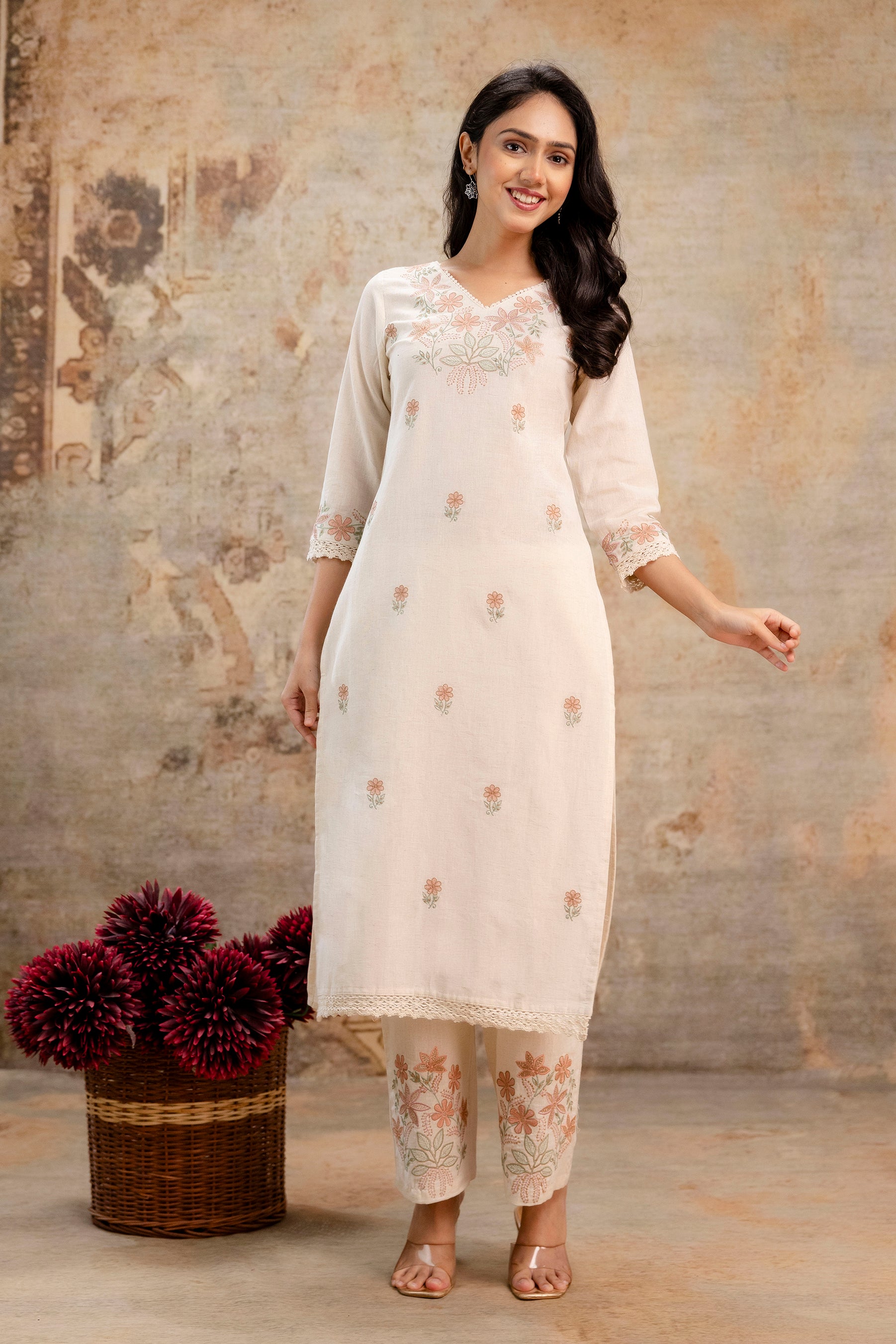 Cream cotton kurti set with floral embroidery by Tanauri – elegant ethnic wear
Tanauri cream kurti and pant set with soft peach floral motifs – festive look
Traditional cream cotton kurti from Tanauri with subtle thread work and lace

Elegant cream ethnic kurti outfit by Tanauri – embroidered neckline and sleeves
Floral embroidered cream kurti with matching pants by Tanauri – casual festive wear
Woman in cream cotton kurti set by Tanauri – soft embroidery and lace detail
Tanauri cotton kurti in off-white