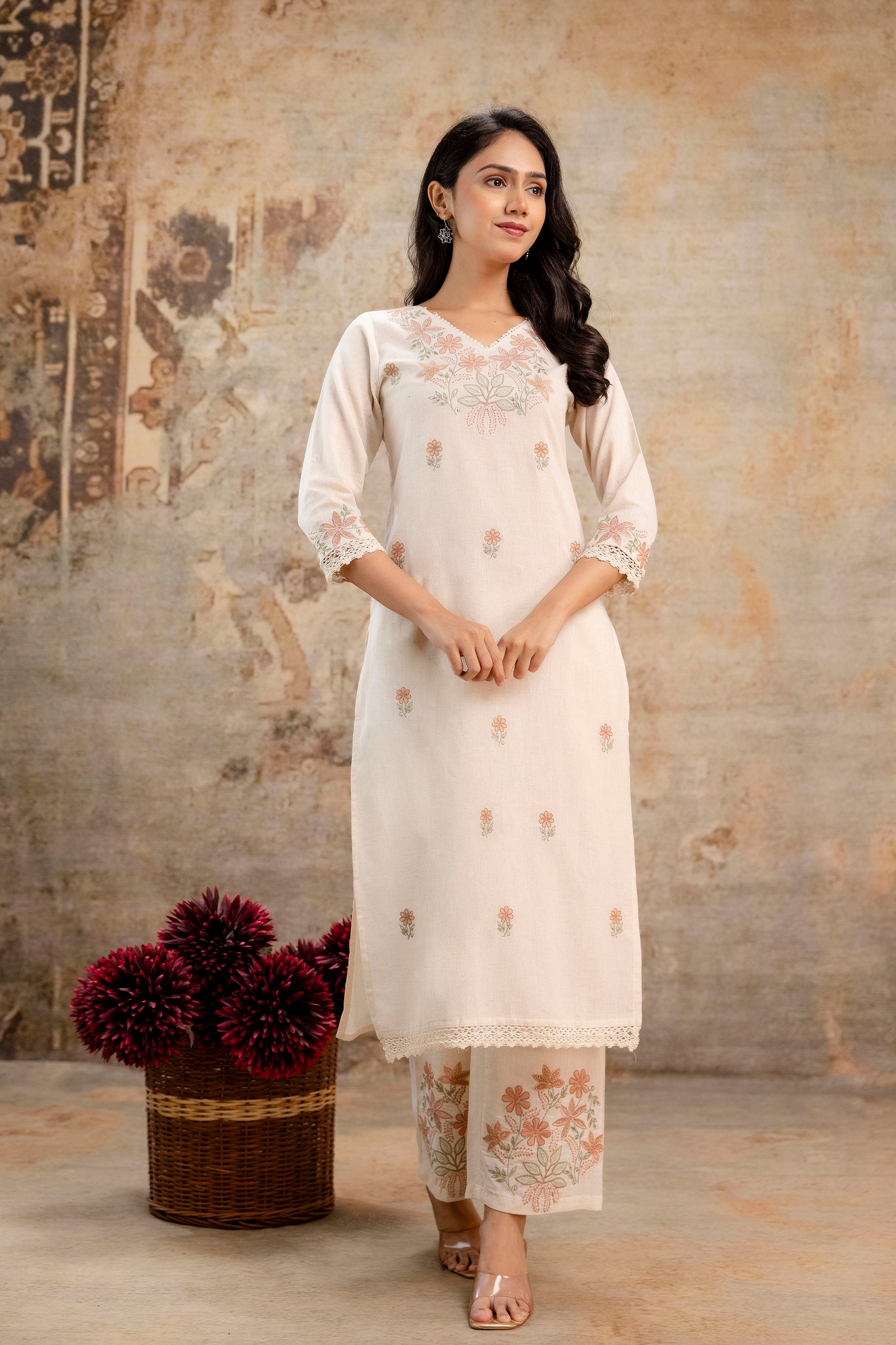 Woman wearing cream embroidered cotton kurti and pants set by Tanauri
Tanauri cream kurti with delicate floral embroidery and matching pants
Elegant Tanauri ethnic cotton kurti set in cream with pastel embroidery
Subtle floral-embroidered cream kurti set by Tanauri – soft and graceful look
Tanauri cotton kurti in off-white with lace trim and floral pant design
Cream ethnic outfit with embroidery and three-quarter sleeves by Tanauri
Stylish festive kurti set by Tanauri – floral neck and sleeve design in cott