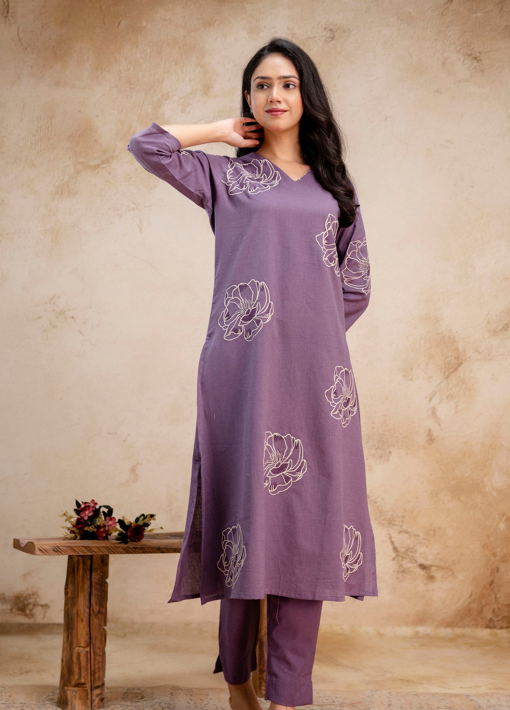1. Tanauri lavender cotton kurti set with white floral embroidery – angled front pose  
2. Lavender embroidered straight kurti with side slits and matching pants – Tanauri look  
3. Elegant lavender ethnic kurti set in cotton with floral motifs – Tanauri front view  
4. Model wearing lavender cotton kurti and pant set with embroidery – by Tanauri  
5. Tanauri lavender kurti outfit with three-quarter sleeves and white floral stitch  
6. Soft lavender embroidered cotton kurti set by Tanauri – stylish ethnic 