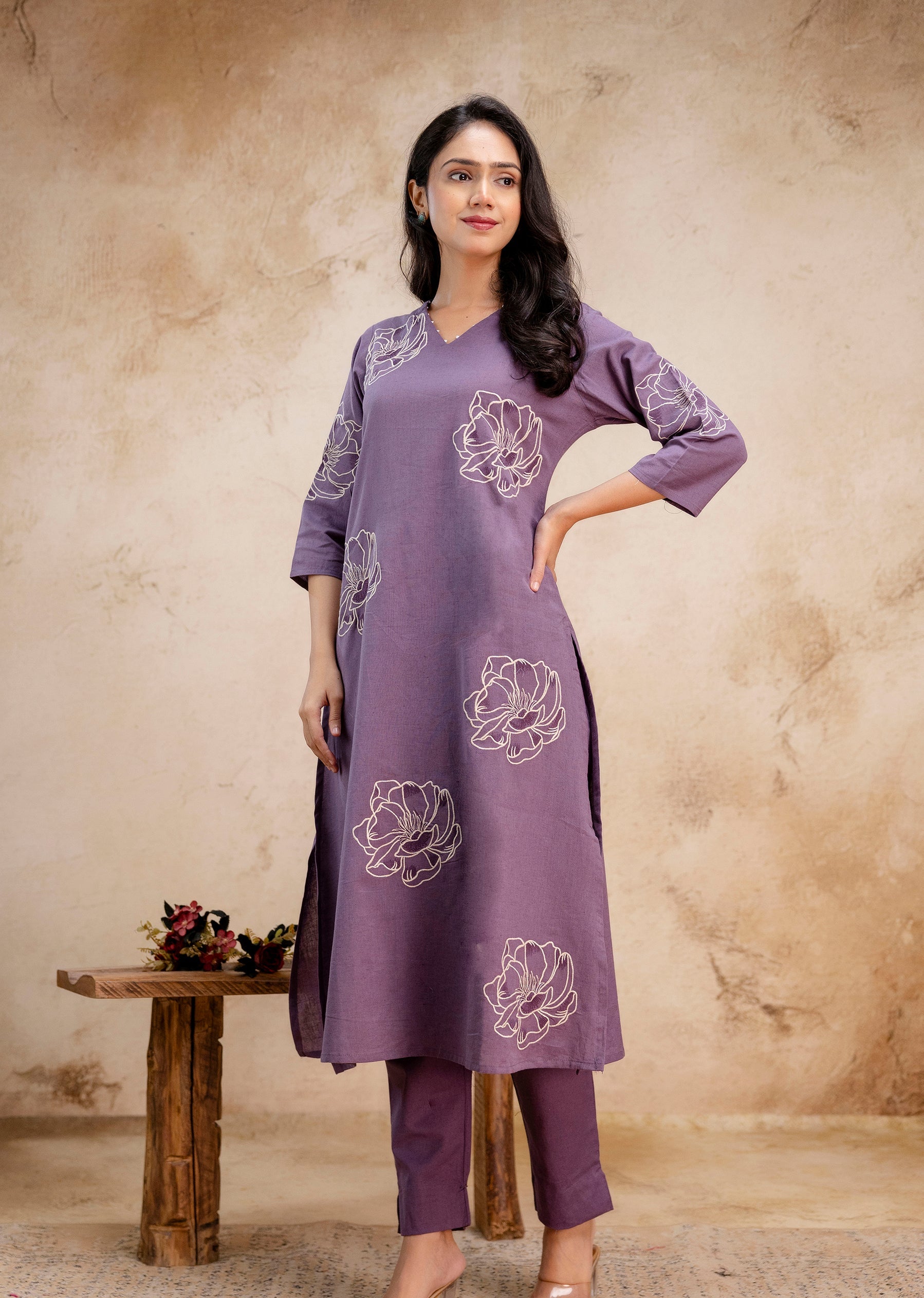 1. Tanauri lavender cotton kurti set with white floral embroidery – front view  
2. Lavender straight-cut embroidered kurti with three-quarter sleeves – Tanauri ethnic wear  
3. Elegant lavender kurti and pant set in cotton by Tanauri – floral motif design  
4. Tanauri cotton kurti set in lavender with minimal embroidery and side slit  
5. Model in Tanauri lavender ethnic kurti with subtle floral threadwork – full outfit view  
6. Lavender embroidered kurti with cotton straight pants – stylish ethnic look 
