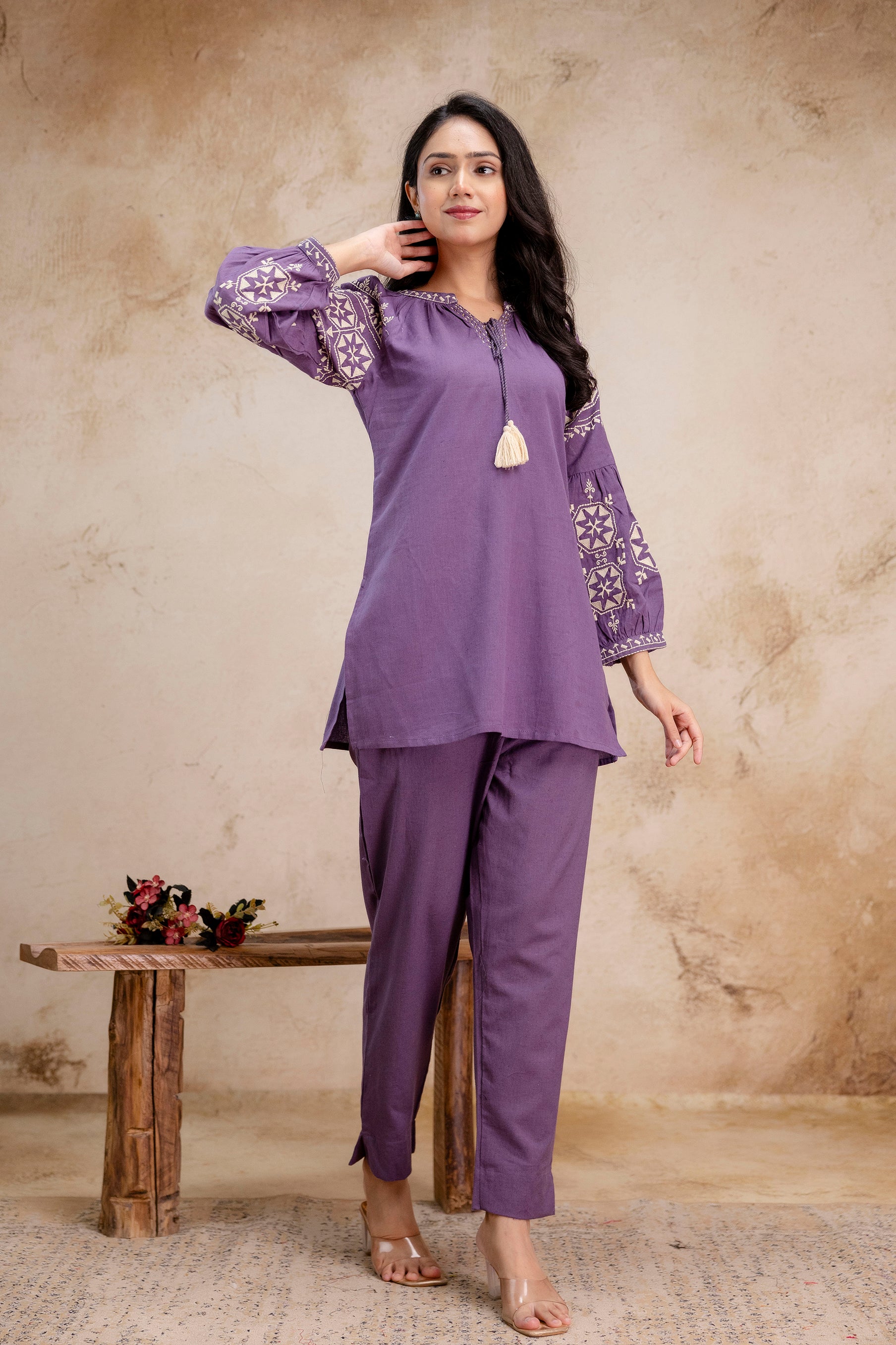 1. Tanauri lavender cotton kurti set with embroidered balloon sleeves – front side pose  
2. Elegant lavender cotton kurti by Tanauri with floral embroidery and tassel tie  
3. Tanauri ethnic cotton kurti and pant set in lavender – full-length side-front view  
4. Balloon sleeve lavender cotton kurti with tassel neckline by Tanauri  
5. Lavender co-ord set for women by Tanauri – embroidered kurti and straight pants  
6. Comfortable and stylish lavender Tanauri kurti set with cotton fabric  
7. Tanauri 