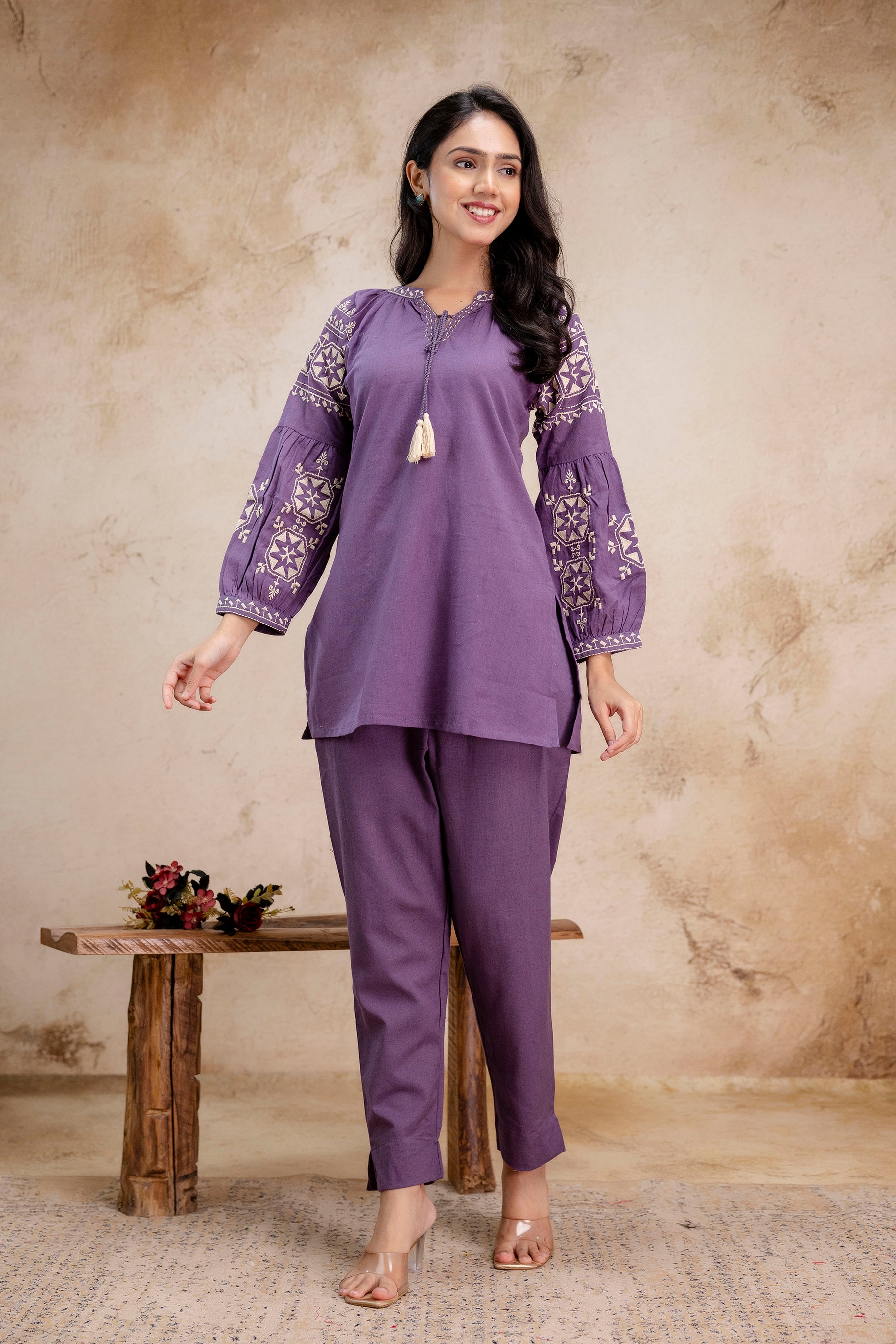 Tanauri lavender cotton kurti set with embroidered balloon sleeves – walking pose  
Lavender ethnic co-ord set by Tanauri with floral sleeve embroidery and tassel tie  
Elegant Tanauri lavender cotton kurti with boho sleeves and tapered pants  
Walking view of lavender kurti and pant set in cotton – Tanauri ethnic wear  
Tanauri women’s lavender kurti outfit with embroidered sleeves and side slits  
 Balloon sleeve lavender kurti with cotton straight pants – Tanauri front pose  
 