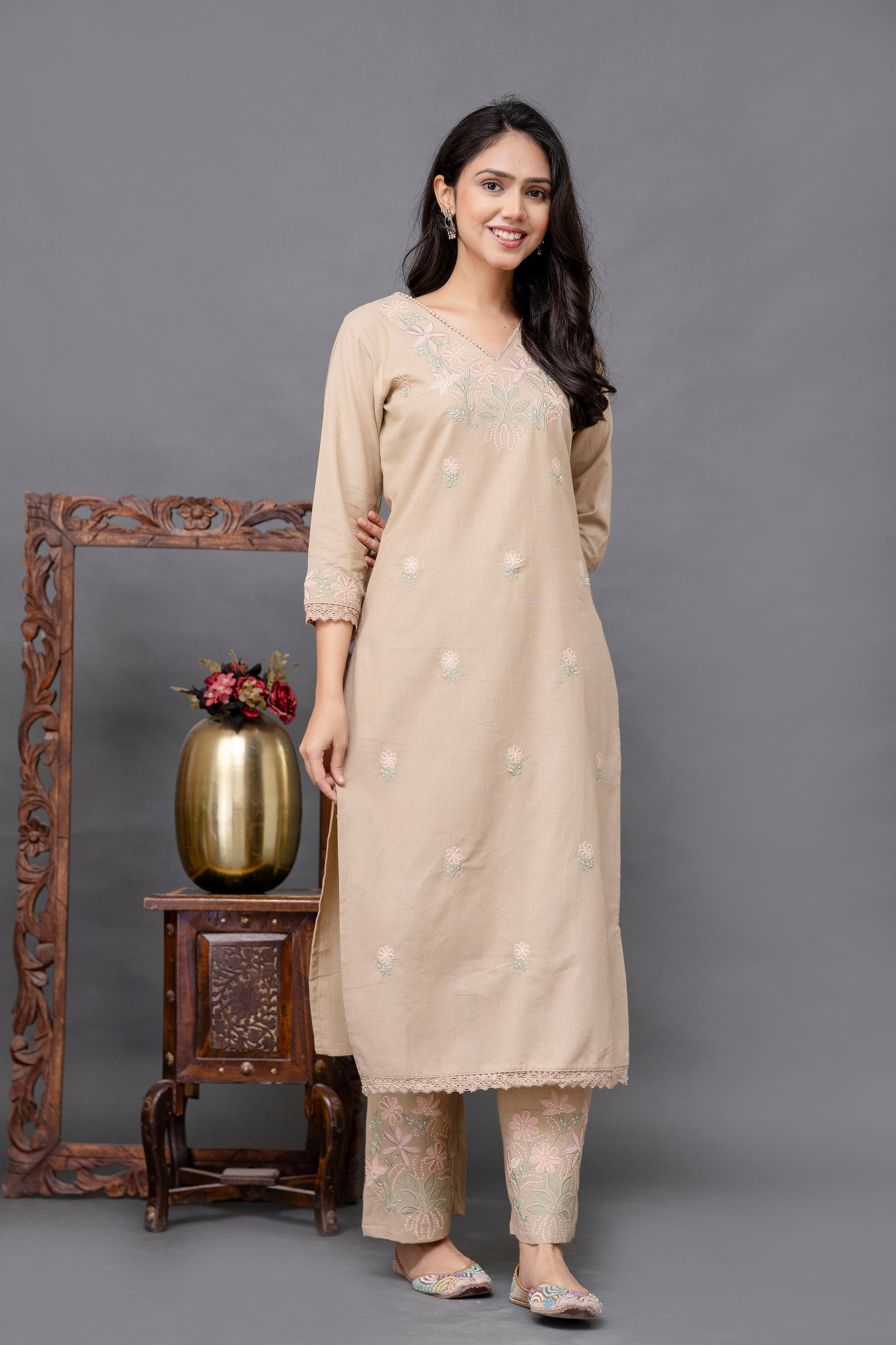 Beige-colored straight kurti with a subtle and elegant appearance

V-neckline highlighted with delicate thread embroidery

Intricate pastel floral embroidery on the chest and lightly scattered on the front panel

Elbow-length sleeves with detailed embroidered cuffs

Straight hem with soft lace border adding finesse

Made from breathable, lightweight cotton fabric – perfect for casual or semi-formal wear

