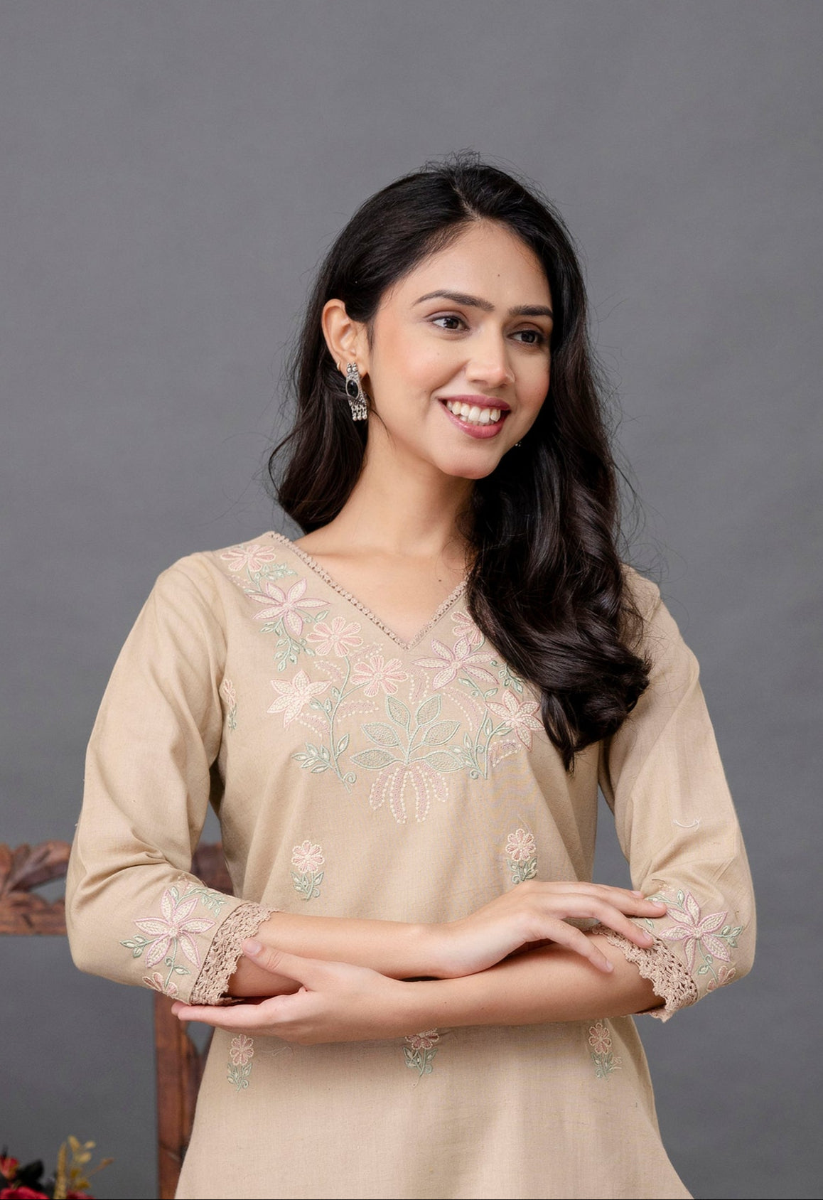Beige-colored straight kurti with a subtle and elegant appearance

V-neckline highlighted with delicate thread embroidery

Intricate pastel floral embroidery on the chest and lightly scattered on the front panel

Elbow-length sleeves with detailed embroidered cuffs

Straight hem with soft lace border adding finesse

Made from breathable, lightweight cotton fabric – perfect for casual or semi-formal wear

