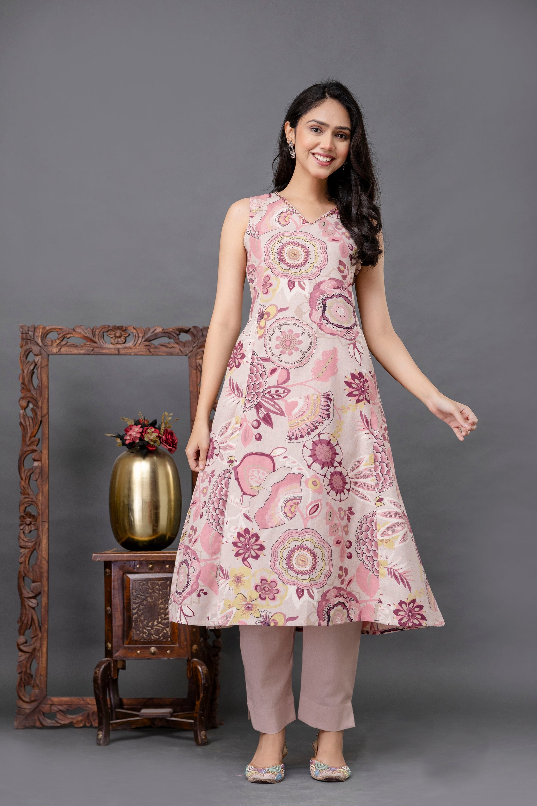 Sleeveless A-line kurti featuring multicolor mandala and floral motifs on a pastel pink base

Soft V-neckline and flared silhouette enhance comfort and movement

Printed in subtle hues of yellow, maroon, and mauve for a graceful ethnic look

Lightweight cotton fabric ideal for summer wear or daytime gatherings

Stylish and breathable kurti designed for casual and festive occasions