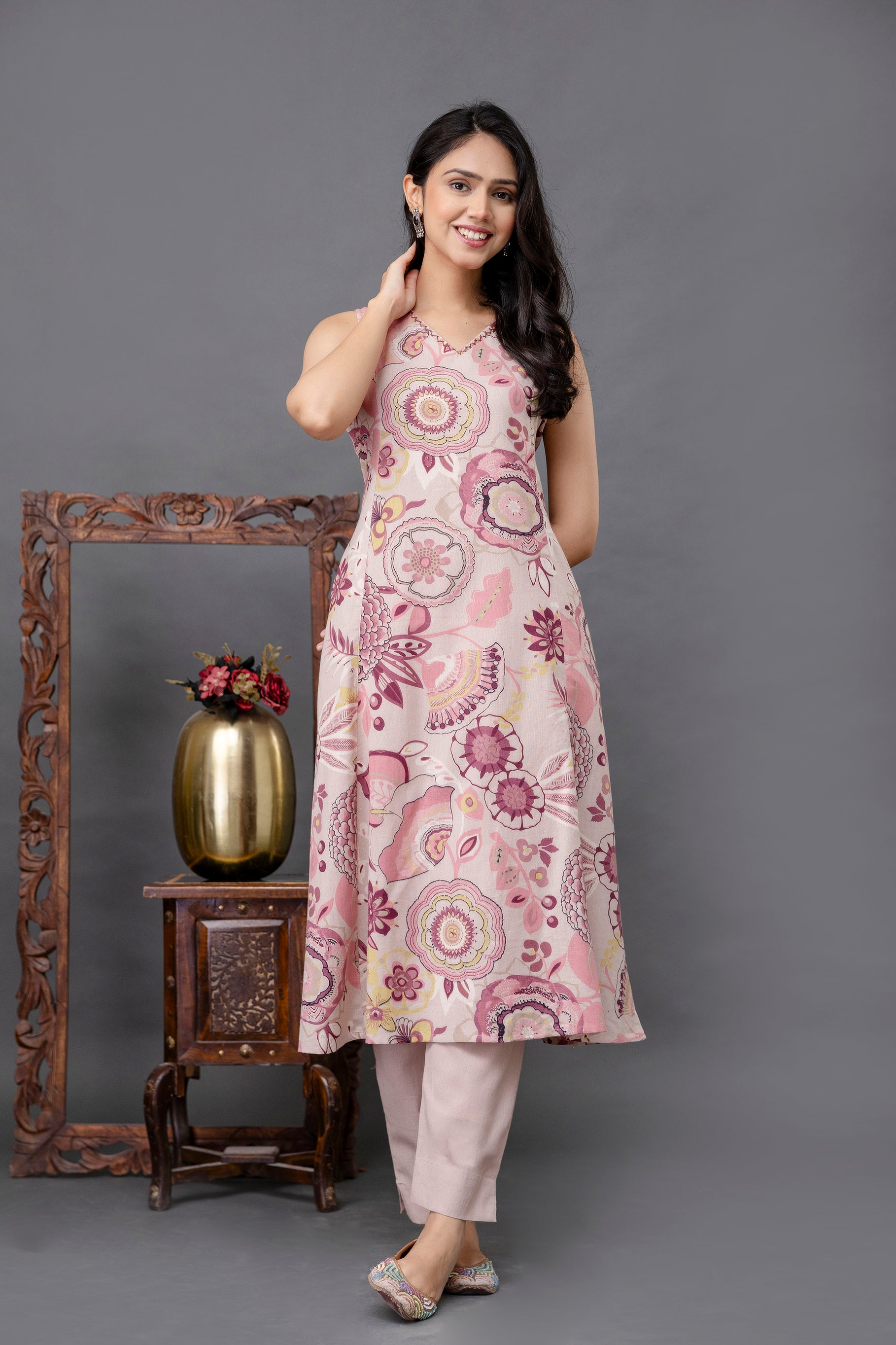 Sleeveless pastel pink kurti adorned with vibrant floral and mandala motifs in shades of purple, yellow, and maroon

Features a soft V-neckline and A-line silhouette for a flattering fit

Crafted from breathable cotton fabric, perfect for warm weather

Ethnic yet modern design, ideal for daytime outings or casual festive gatherings

Lightweight and comfortable daily wear kurti for women