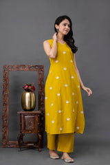 Back view of mustard embroidered cotton kurta set – handcrafted Mustard Embroidered Lotus Kurta Set by Tanauri.