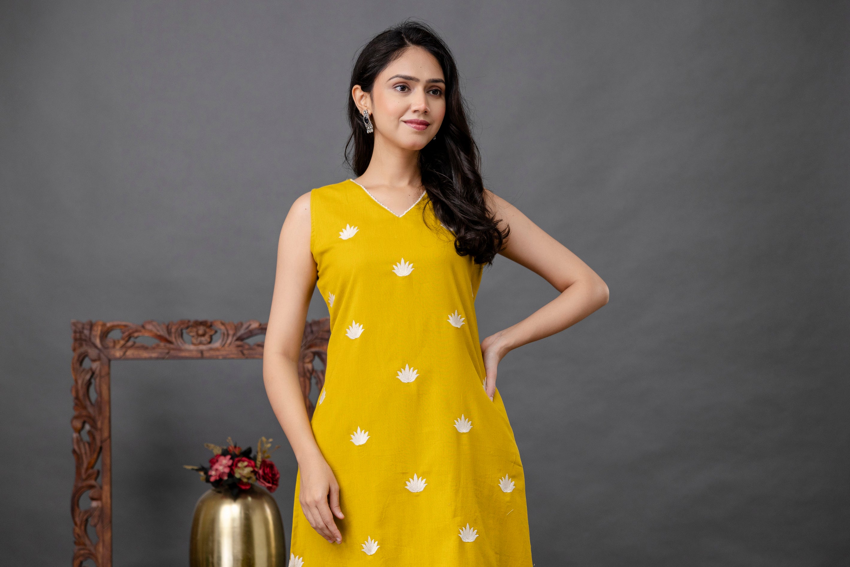 White lotus embroidery detail on mustard cotton-blend fabric – Tanauri Mustard Embroidered Kurta Set.