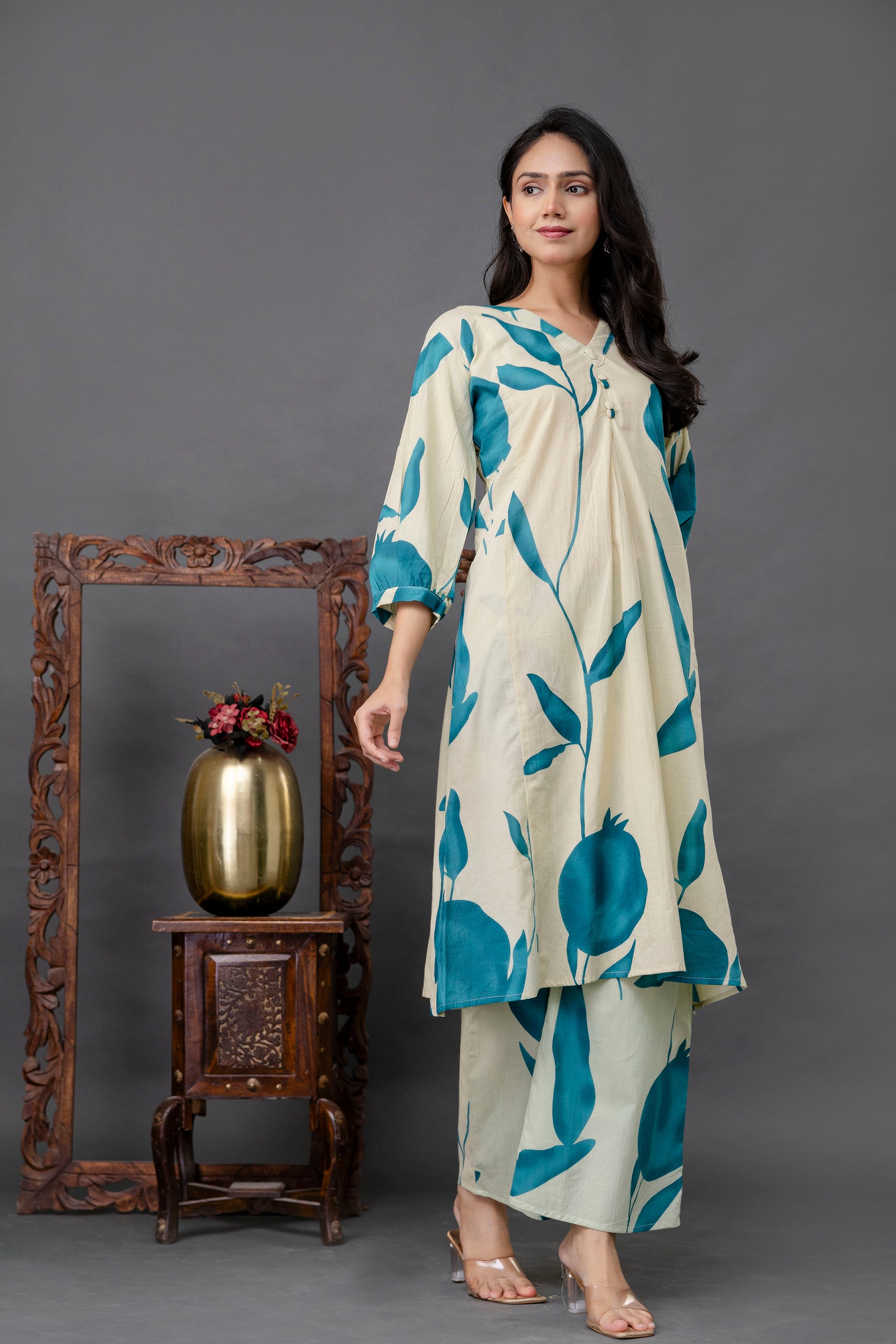Cream kurti with teal pomegranate print

Teal leaf print cotton kurti set

Botanical motif kurta for women

Elegant three-quarter sleeve kurti

V-neck kurti with front pleat detailing

Stylish kurti with artistic plant design

Abstract nature print kurta

Ethnic wear with bold teal prints

Indo-western cotton kurta set

Contemporary floral printed kurti

Statement co-ord set for women

Oversized botanical design kurti

Summer-ready breathable kurta set

Chic kurti with nature-inspired art