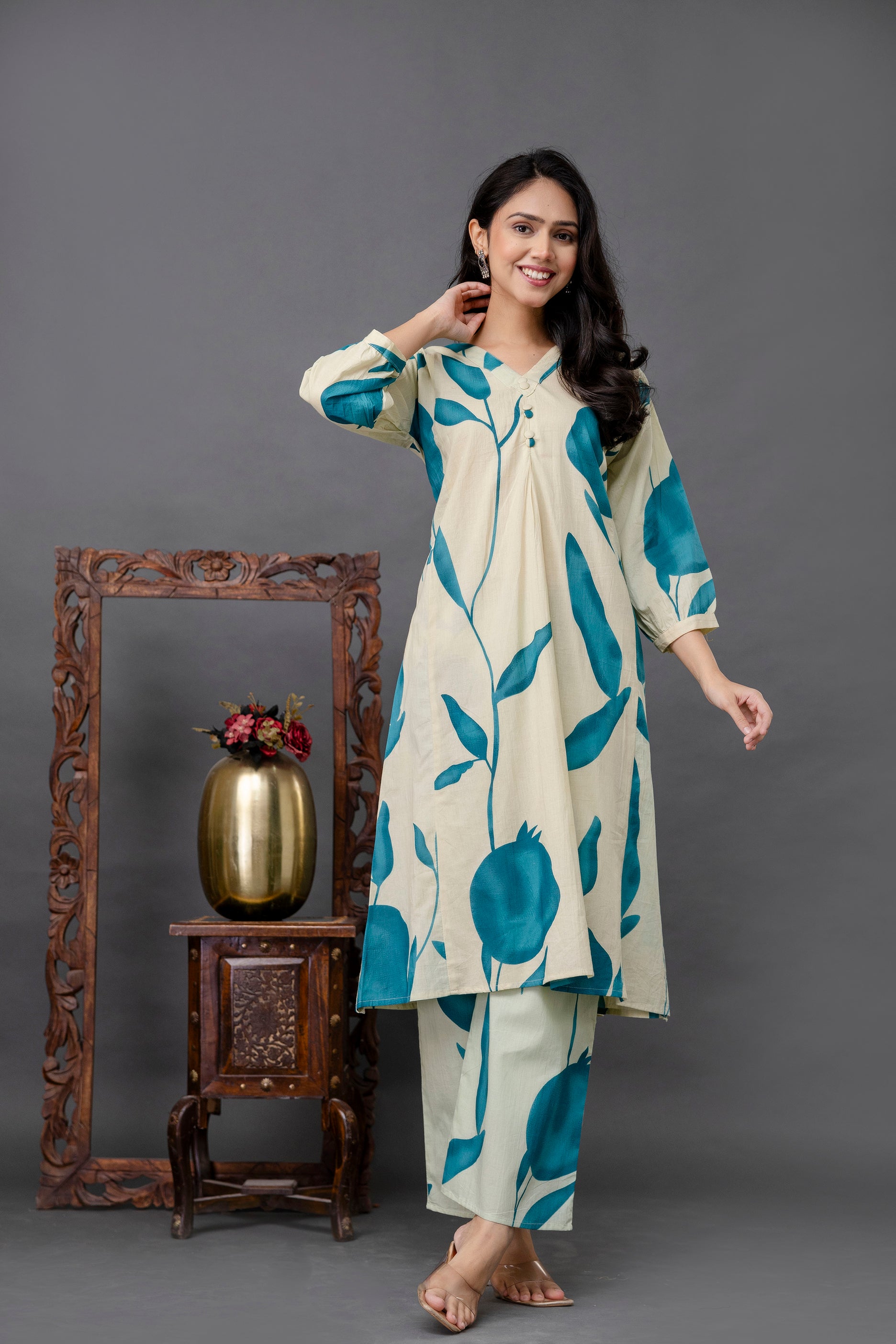 Cream kurti with teal fruit print

Teal pomegranate motif kurti

Nature-inspired printed kurti

V-neck cream kurti with buttons

Three-quarter sleeve cotton kurta

Artistic plant print ethnic kurti

Straight fit kurti for women

Contemporary botanical kurti design

Teal printed casual kurti

Printed cream kurta with pleats

Daily wear cotton kurti with motifs

Long kurti with bold teal pattern

Floral art kurti for summer

Lightweight printed ethnic wear

Elegant straight kurta with plant print

Modern