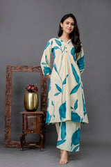 Detailed teal pomegranate and leaf motifs on soft ivory cotton-blend fabric – Tanauri Leafy Edit Kurta Set.