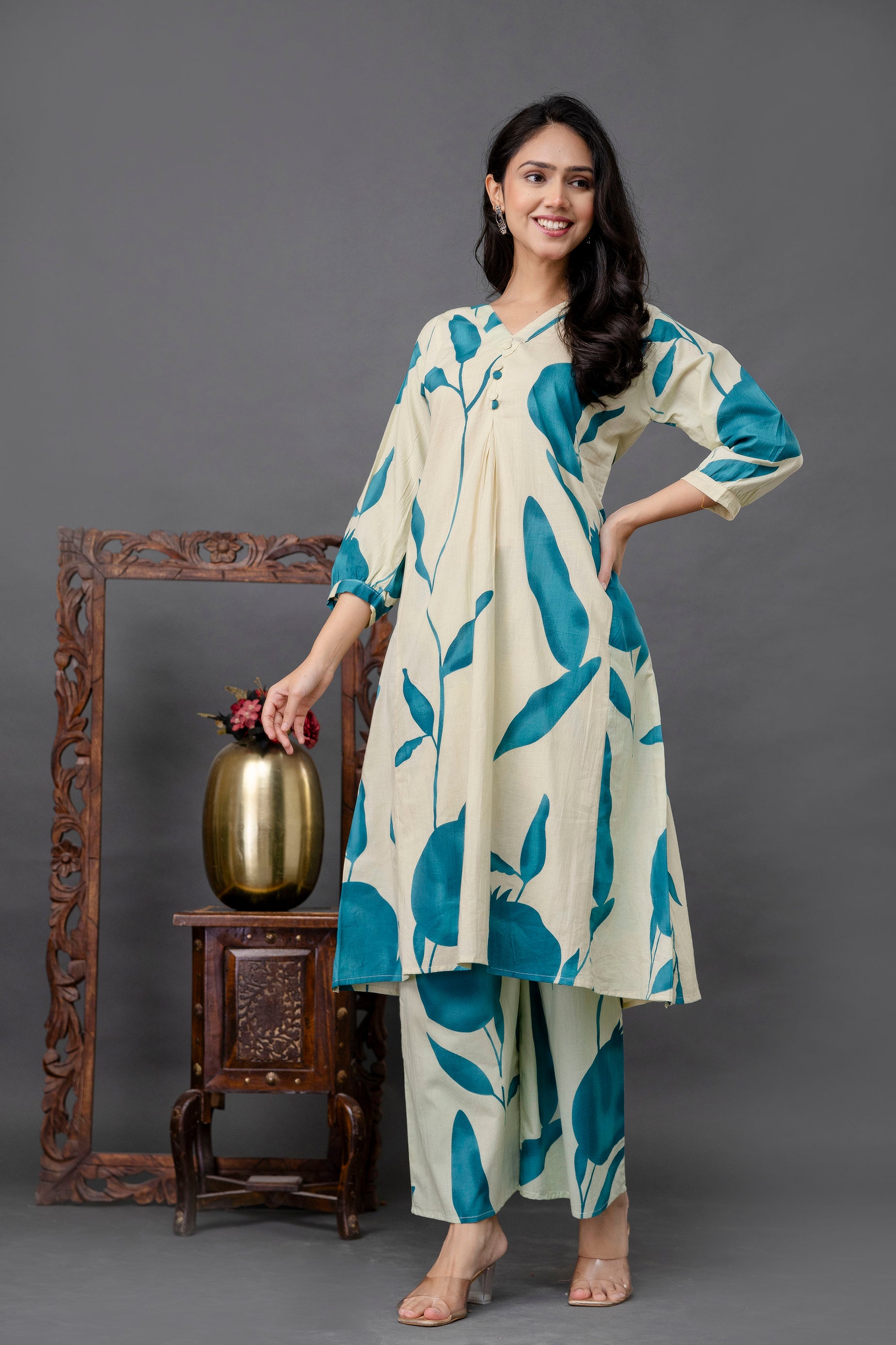 Cream kurti with teal pomegranate print

Teal botanical print cotton kurta

Stylish nature motif kurti for women

Printed V-neck kurta with front pleats

Long cotton kurti with teal leaves

Cream and turquoise kurti set

3/4 sleeve printed cotton kurta

Lightweight ethnic kurti for summer

Designer teal kurti with nature theme

Casual wear plant print kurta

Kurta set with large teal motifs

Pleated front button detail kurti

Modern leafy print ethnic wear

Comfortable cotton kurti for daily wear

Elegant 