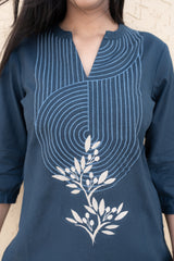 Navy blue kurta with white floral embroidery on a neutral background