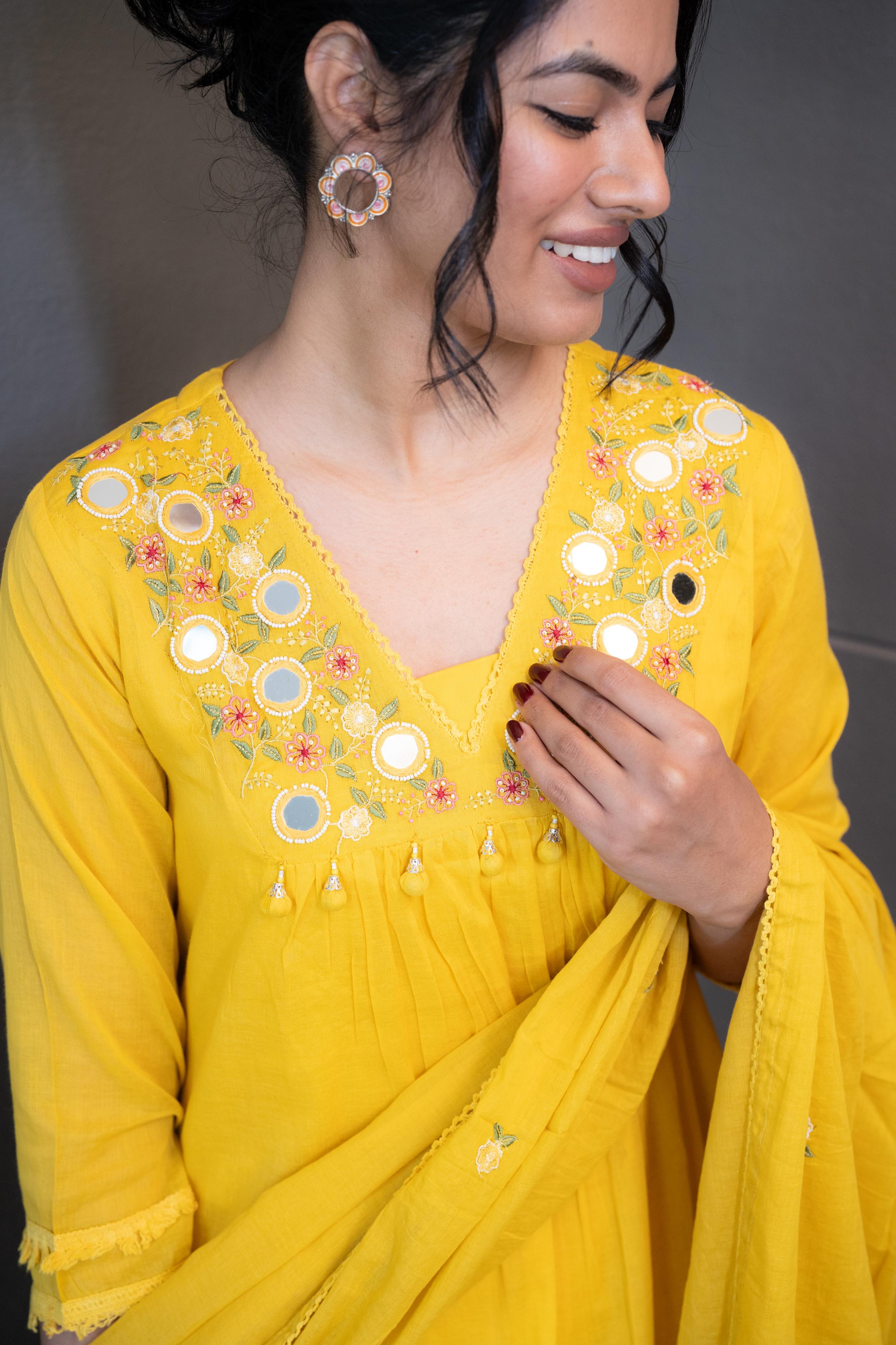 Marigold Magic Dupatta Set by Tanauri: Yellow cotton three-piece suit with embroidered V-neckline and matching textured dupatta.