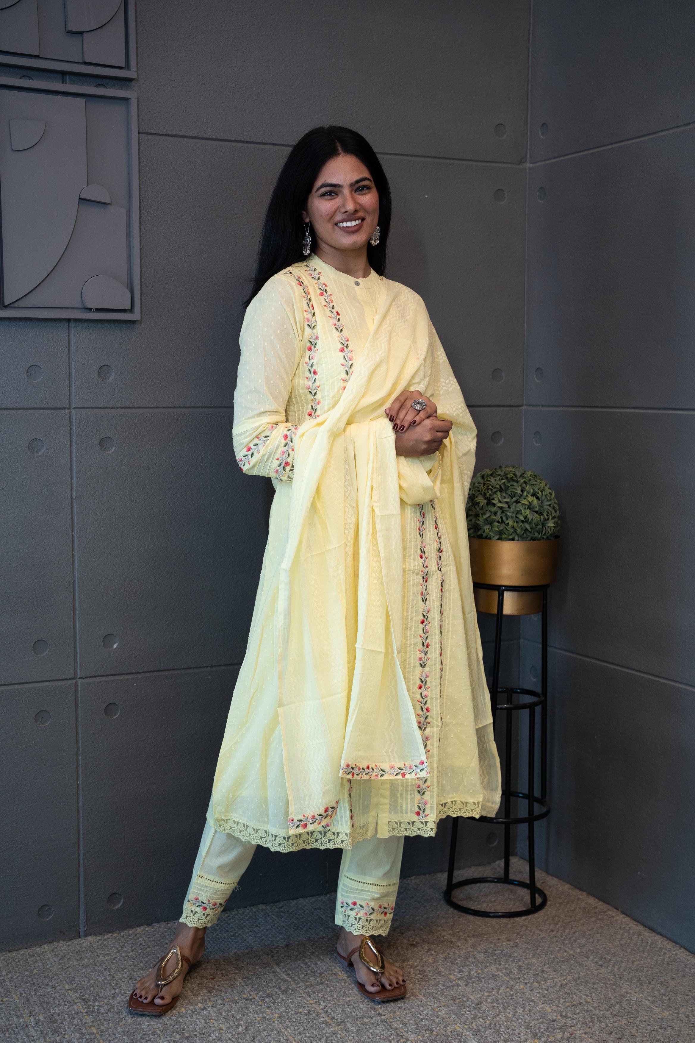 Sun Dew Dupatta Set by Tanauri: Light yellow cotton three-piece suit with embroidered round neckline and matching textured dupatta