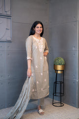 Tanauri Dusky Dupatta Set: Elegant beige cotton ethnic wear set with embroidered kurti and matching dupatta. Perfect for casual or festive Indian occasions.
