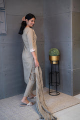 Tanauri Dusky Dupatta Set: Elegant beige cotton ethnic wear set with embroidered kurti and matching dupatta. Perfect for casual or festive Indian occasions.