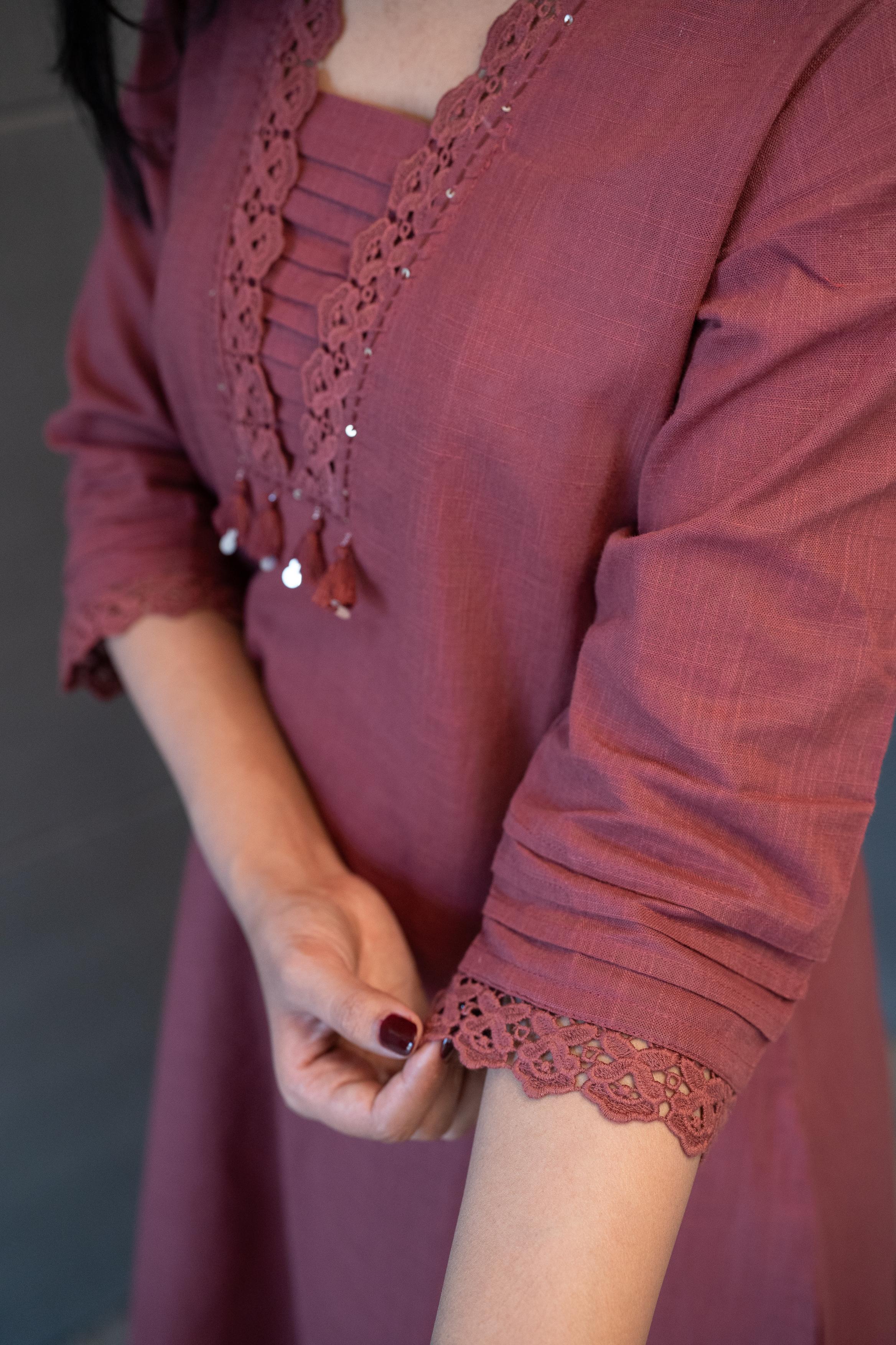 Close-up of the delicate lace, subtle sequins, and hanging tassels on the neckline of the Tanauri Mauve Melange Kurta