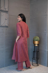 Close-up of the delicate lace, subtle sequins, and hanging tassels on the neckline of the Tanauri Mauve Melange Kurta