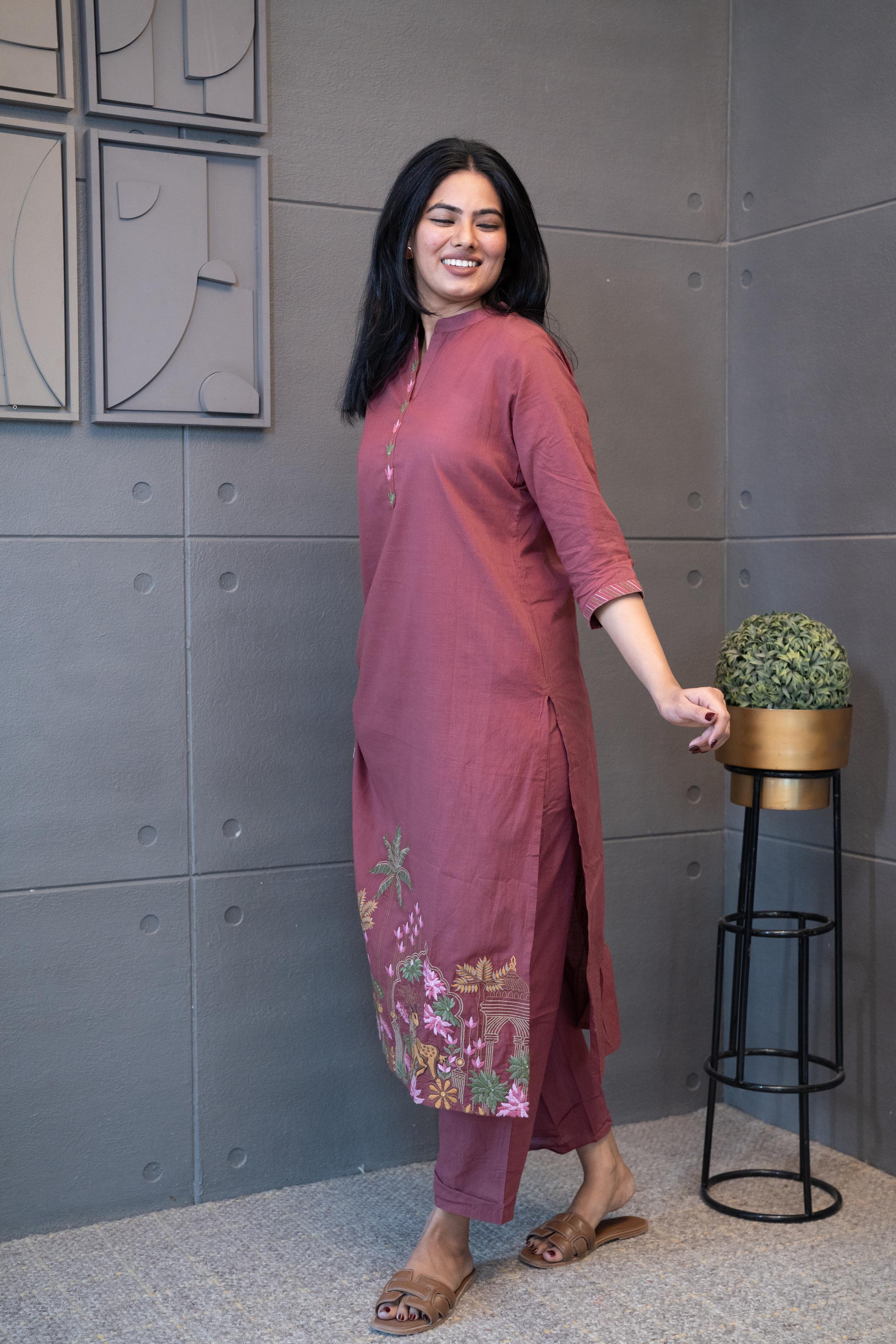 Tanauri Mauve Deer Delight Kurta Set, folded in packaging, showing hand-embroidered pink and green floral details on a cotton kurti