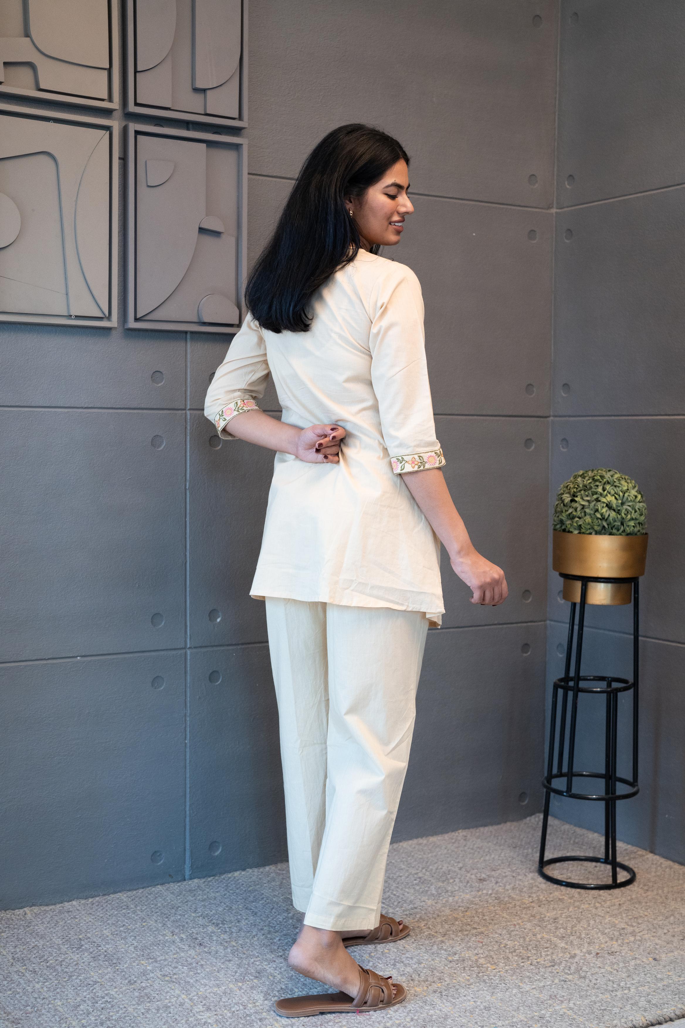 Floral embroidery details on cream cotton fabric – Tanauri Coral Ease Co-Ord Set.