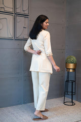 Floral embroidery details on cream cotton fabric – Tanauri Coral Ease Co-Ord Set.