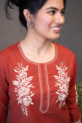 Detailed view of the soft, breathable terracotta cotton fabric texture of the Tanauri Sun Baked Rose Short Kurti/Top