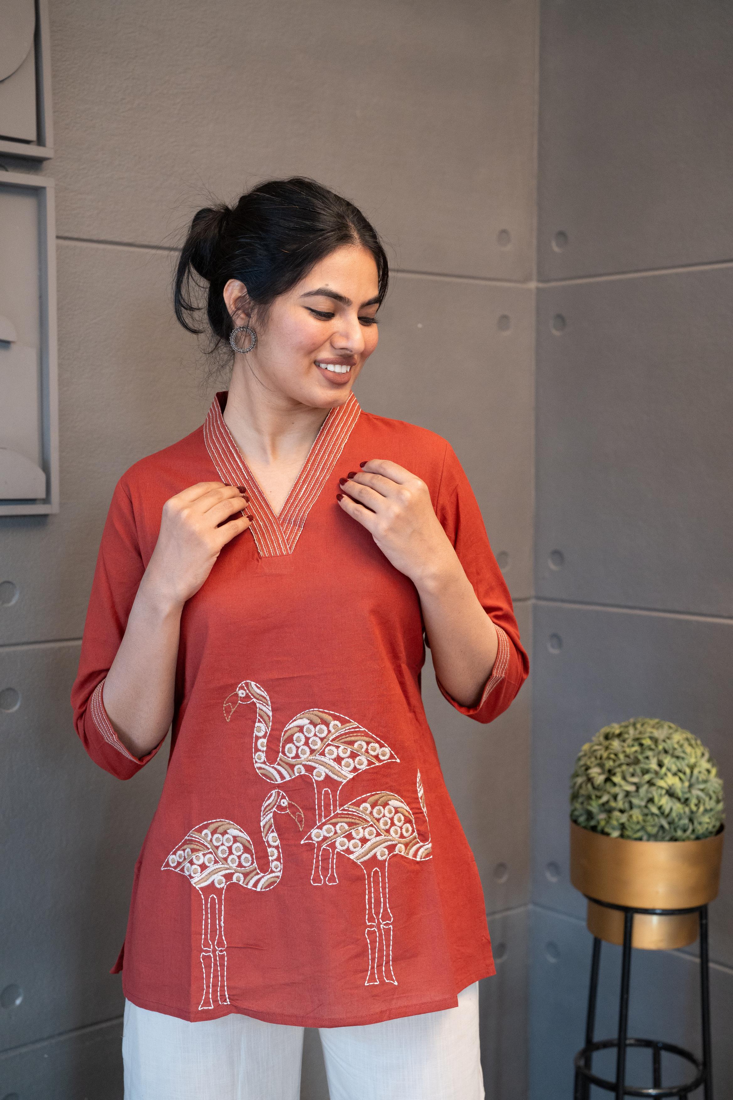 Detailed view of the soft, breathable brick red cotton fabric texture of the Tanauri Mastani Short Kurti/Top