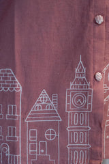 Detailed view of the soft, breathable blush pink cotton fabric texture of the Tanauri Pink Cityscape Short Kurti/Top