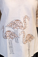 Close-up of the V-neckline of the Tanauri Swan Short Kurti/Top, highlighting the subtle vertical stitched texture