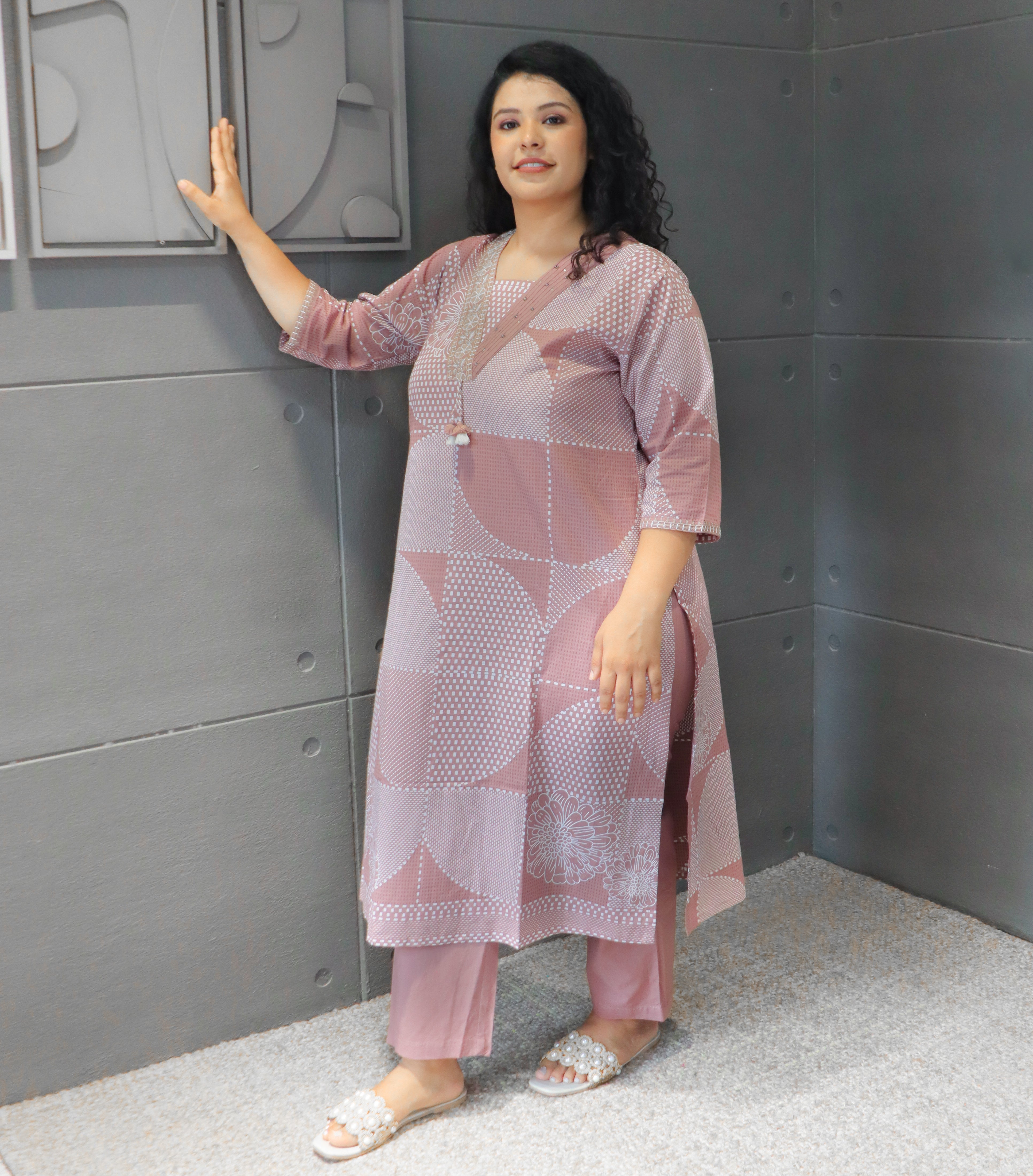 Soft mauve cotton kurta fabric with intricate white floral and geometric patterns.