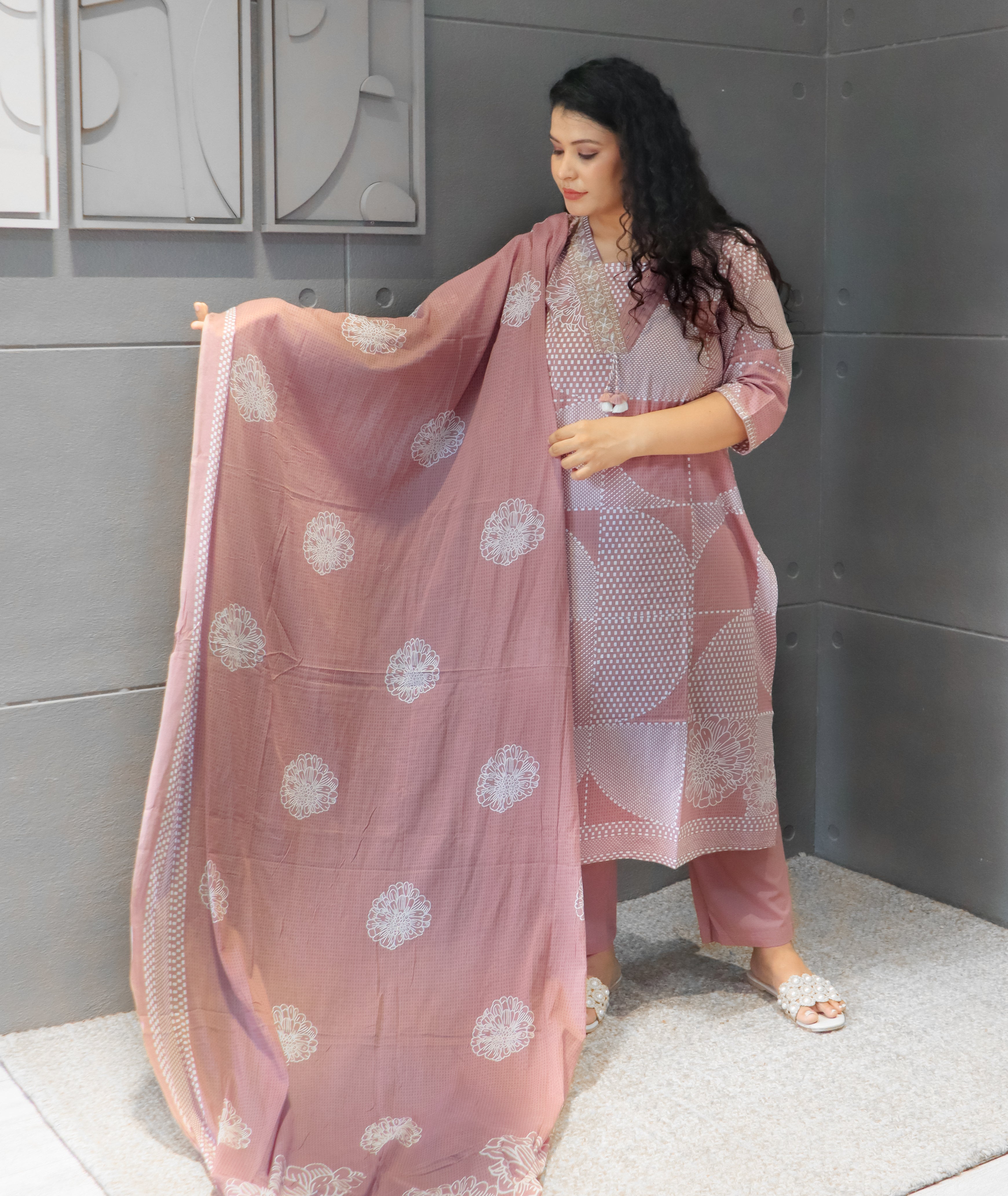 Back design of mauve Nayab cotton kurta set with floral prints and matching dupatta.