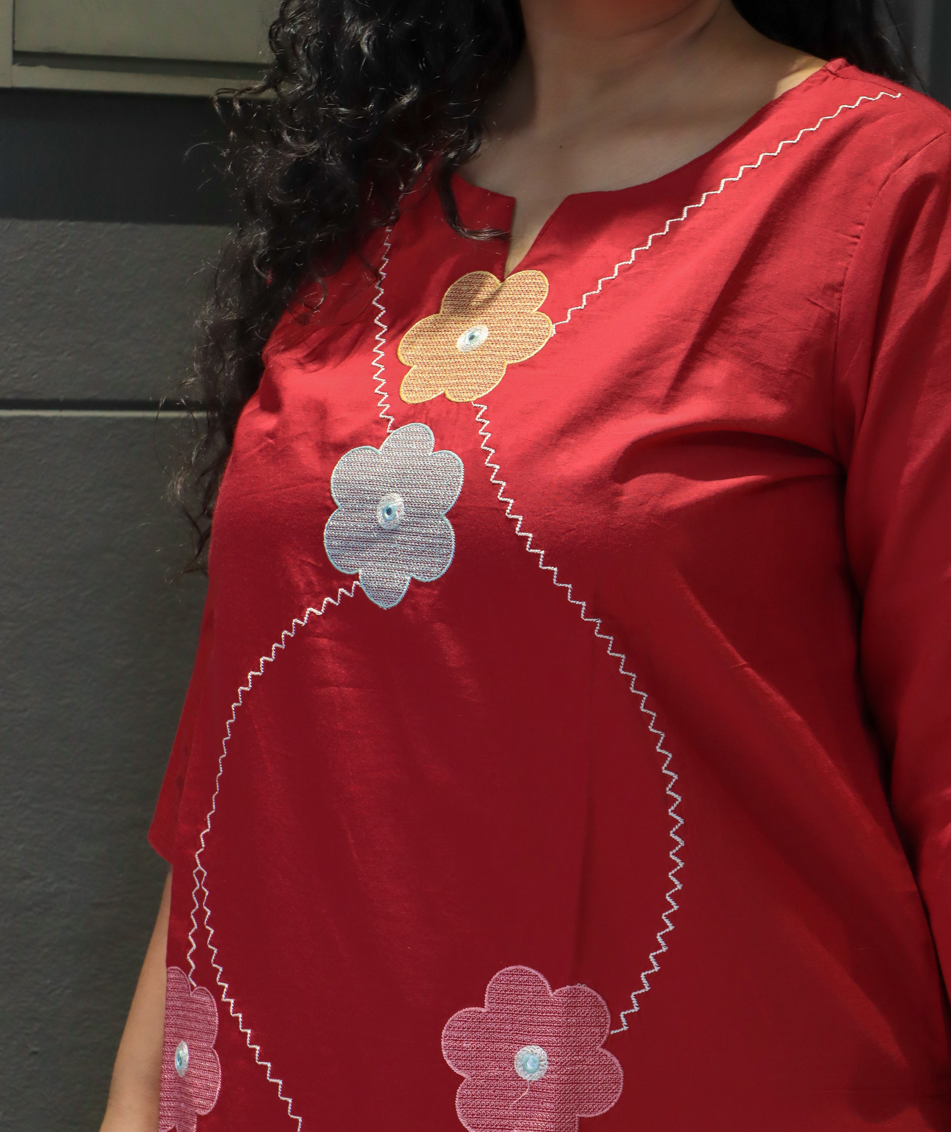 Back design of red cotton kurta with applique embroidery – Rangtaari Threads Dupatta Set.