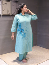 Soft mint green cotton fabric with elegant embroidered bird motifs – Tanauri.