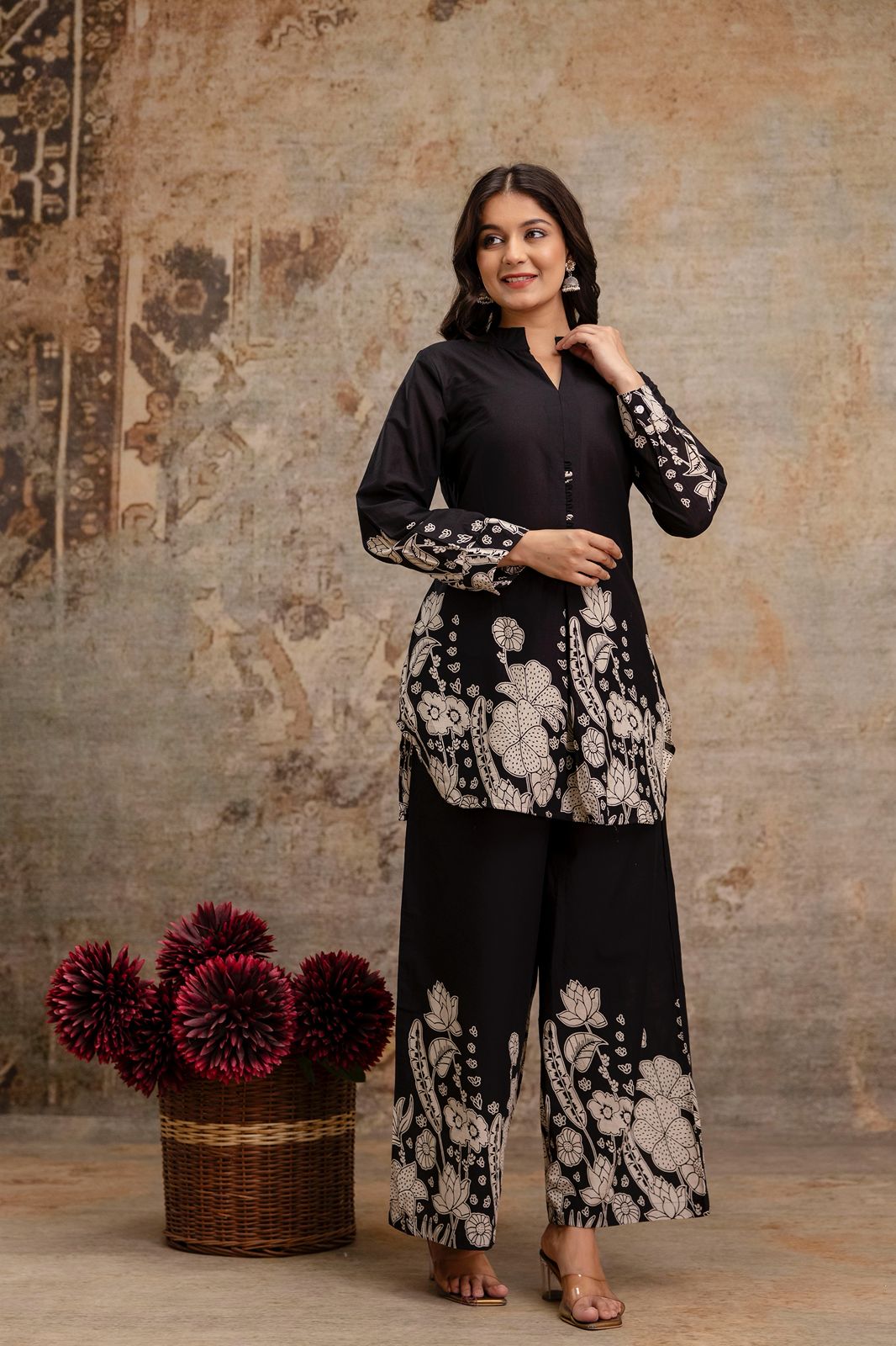 1. Black cotton kurti and pant co-ord set with white floral block print  
2. Elegant black ethnic wear set for women with handcrafted button placket  
3. Front view of black kurti and wide-leg pants with printed floral border  
4. Stylish black co-ord set with floral printed sleeves and hem – ethnic look  
5. Two-piece black kurti set for women in breathable cotton fabric  
6. Black ethnic kurti and pant set with traditional block print – front pose  
7. Full-length black floral kurti set with mandarin 