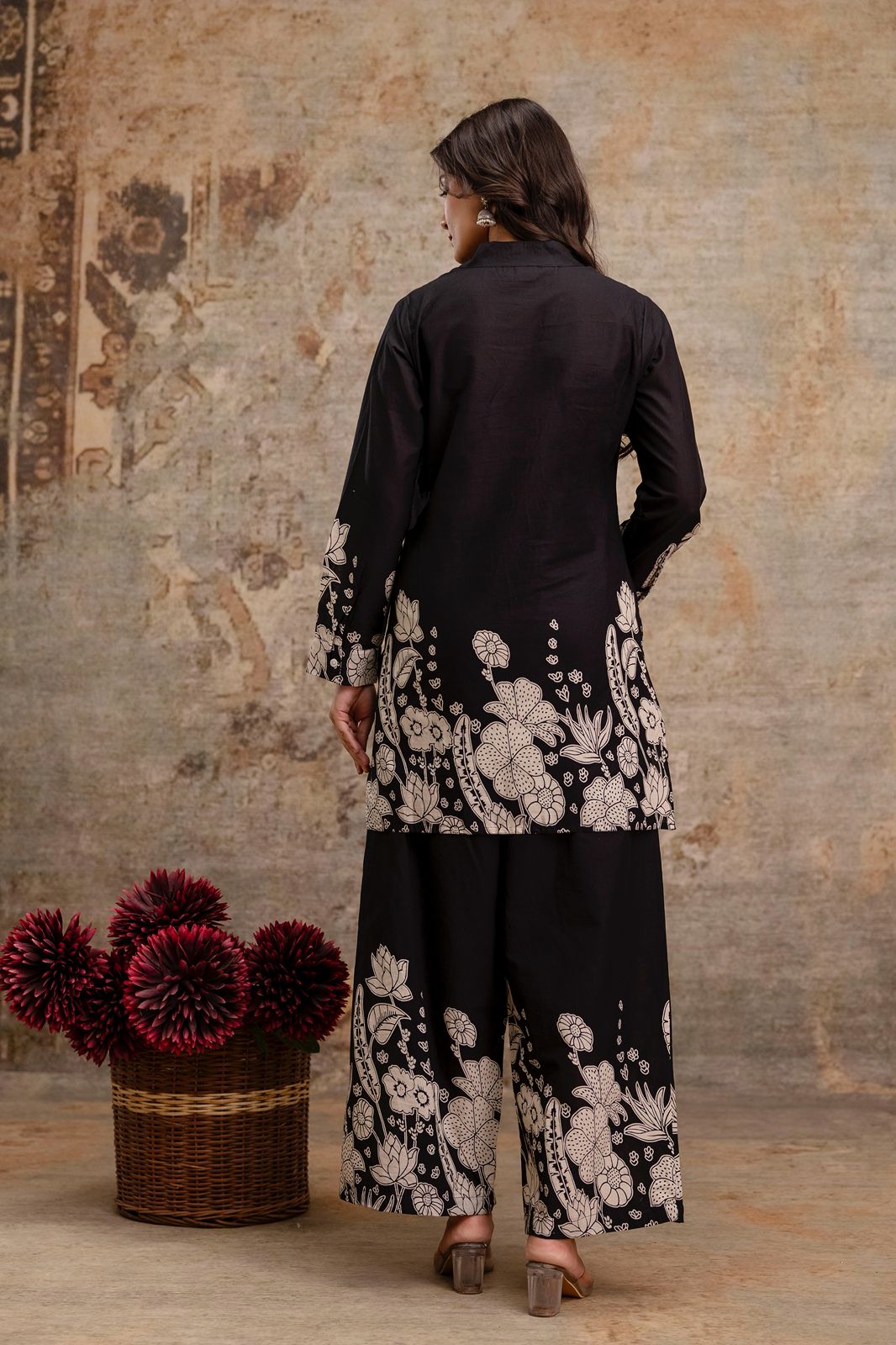 1. Back view of black cotton kurti and pant co-ord set with floral block print  
2. Black ethnic wear set with white floral print on back and sleeves – rear angle  
3. Rear pose of black kurti and trouser set with traditional floral motifs  
4. Elegant black co-ord kurti set for women – printed cuffs and hemline  
5. Two-piece black ethnic set with wide-leg pants and floral printed back  
6. Black kurti set in breathable cotton with floral motifs – back view  
7. Stylish black ethnic outfit with handcrafted