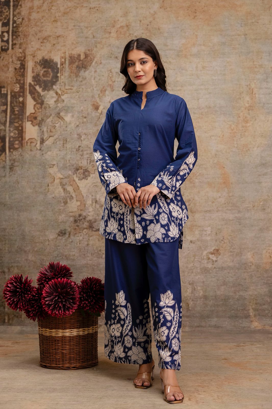 1. Front view of navy blue kurti and pant co-ord set with white floral print  
2. Navy blue cotton ethnic set for women with handcrafted button placket  
3. Elegant navy kurti set with floral cuffs and hem – straight pants style  
4. Navy ethnic co-ord set in breathable cotton with block printed design  
5. Two-piece navy blue outfit with printed kurti and wide-leg trousers  
6. Traditional navy kurti and pant set with white floral motifs – front pose  
7. Women’s navy co-ord set with floral borders 