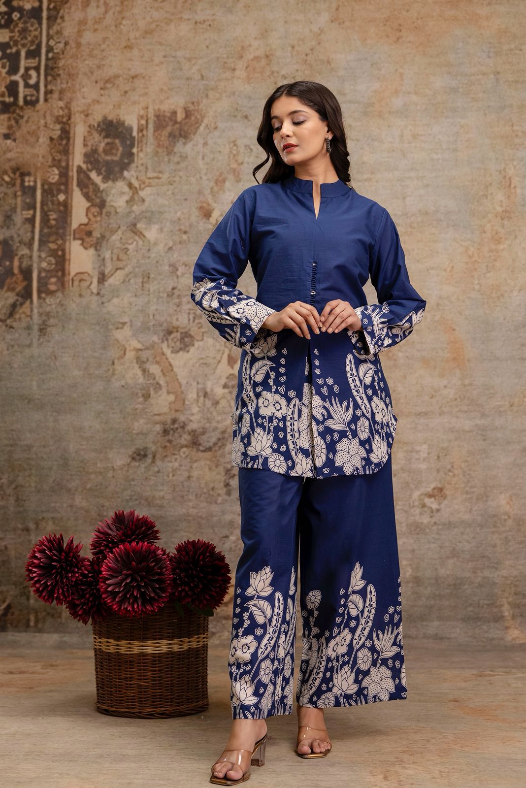 1. Navy blue cotton kurti and pant co-ord set with white floral block print  
2. Elegant navy ethnic co-ord set for women – front view with full sleeves  
3. Floral printed navy kurti set with side slit and straight pants  
4. Navy blue ethnic wear co-ord set in breathable cotton fabric  
5. Stylish navy kurti set with handcrafted button details and printed sleeves  
6. Two-piece navy cotton outfit with white floral motifs – ethnic fashion  
7. Front view of navy blue kurti and wide-leg pant set – tradition